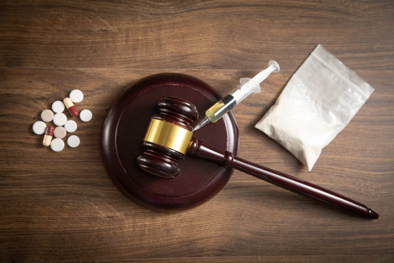 judge-gavel-with-syringe-drugs-packet-heroin